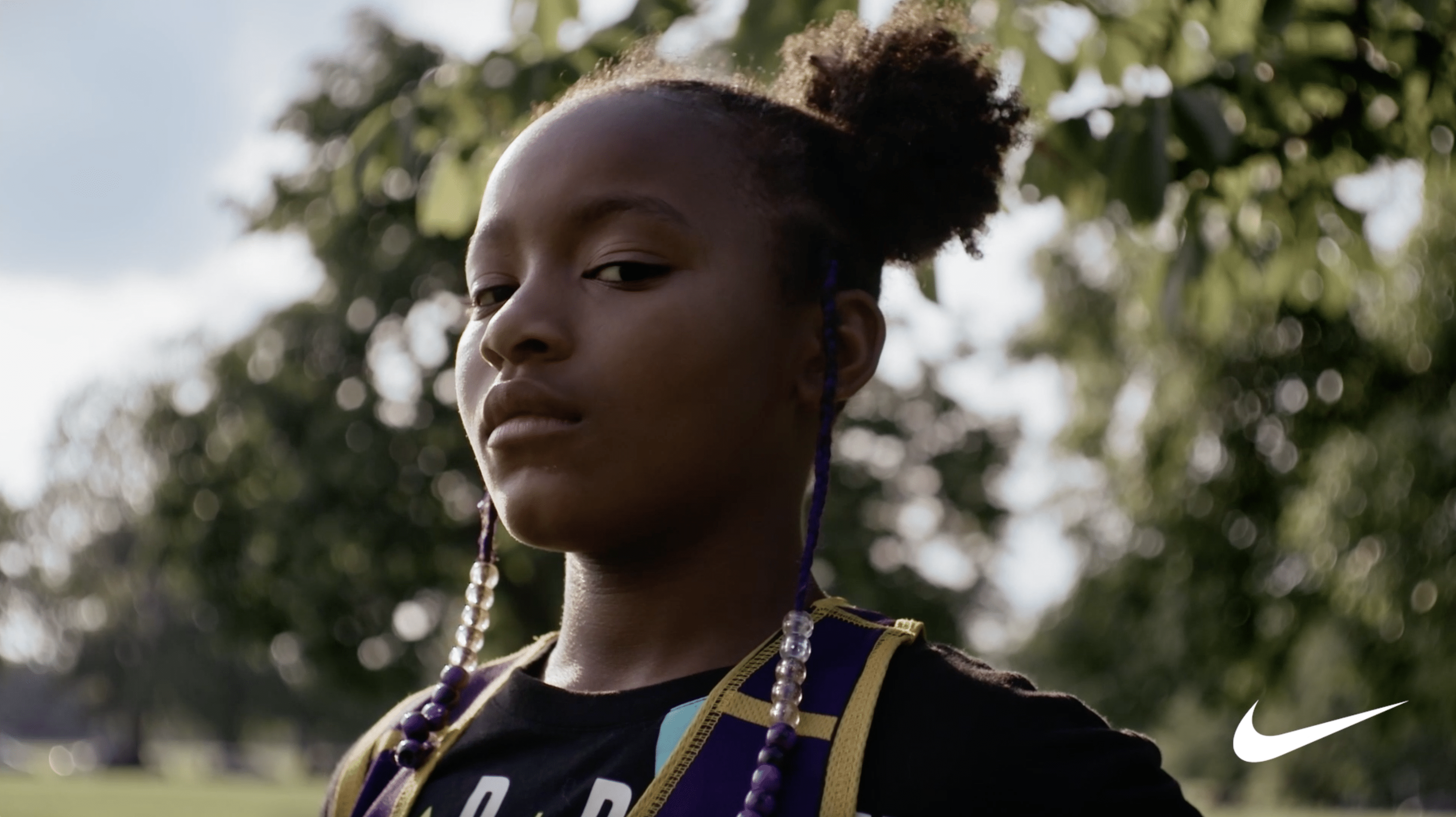 A young woman looks into the camera
